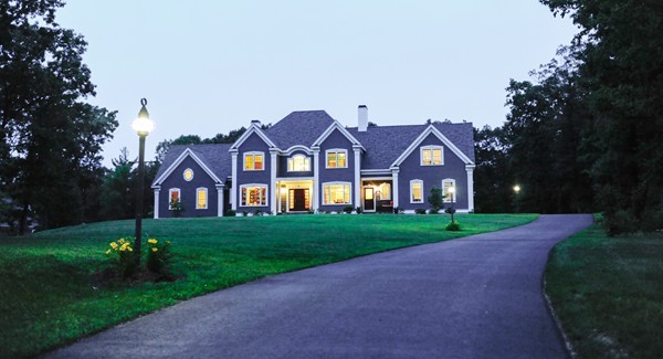 26 Cider Circle Bolton, MA 01740 - Photo 30 of 30 a front view of a house with a yard and garage