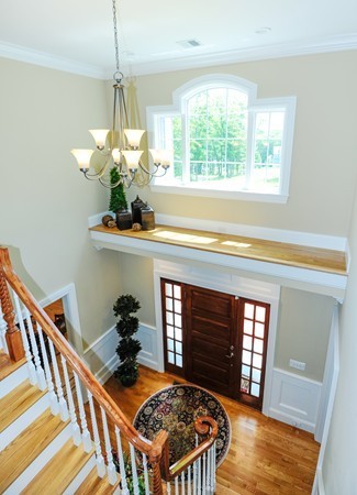 26 Cider Circle Bolton, MA 01740 - Photo 5 of 30 a living room with a bed furniture and a chandelier