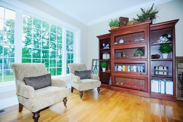 26 Cider Circle Bolton, MA 01740 - Photo 8 of 30 a living room with furniture and a book shelf