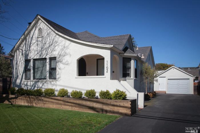 1102 D Street Petaluma, CA 94952 - Photo 1 of 1 a front view of a house with a yard and garage