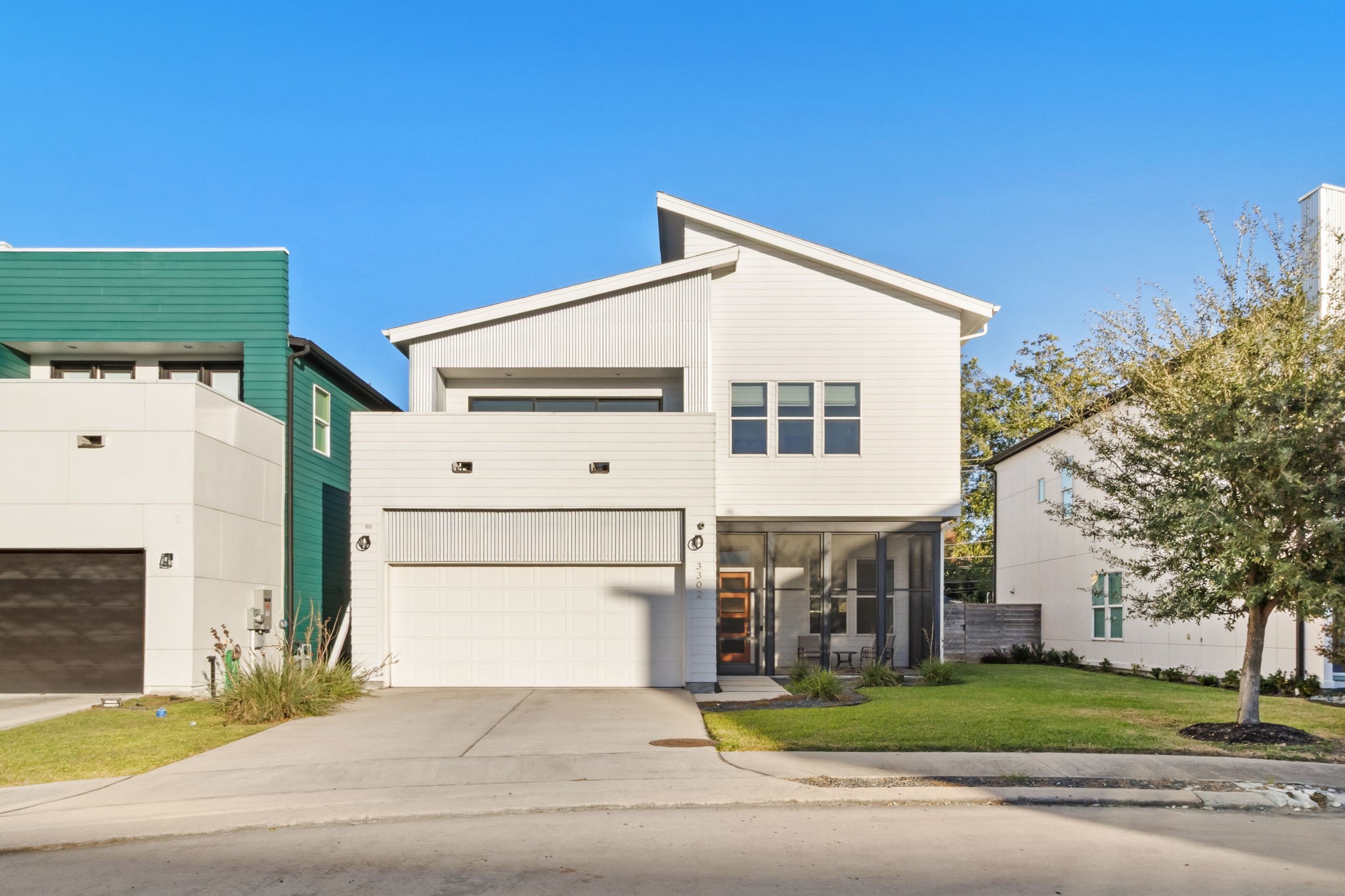 3302 Cardinal Crest Lane Houston, TX 77080 - Photo 1 of 46 a view of a white house with a yard and garage