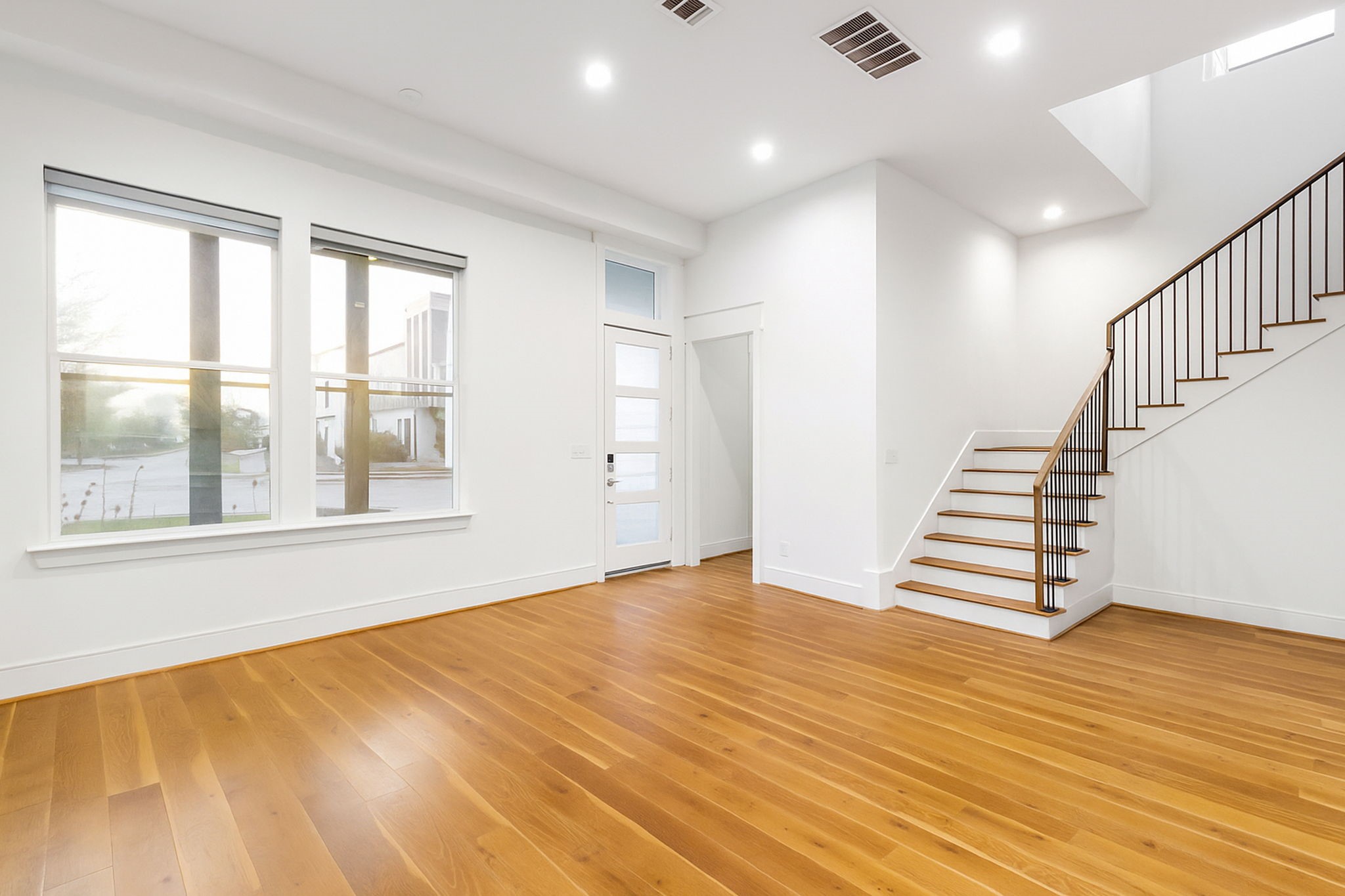 3302 Cardinal Crest Lane Houston, TX 77080 - Photo 8 of 46 a view of an empty room with wooden floor and a window