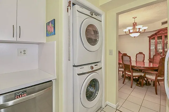 a view of a storage and utility room with washer and dryer