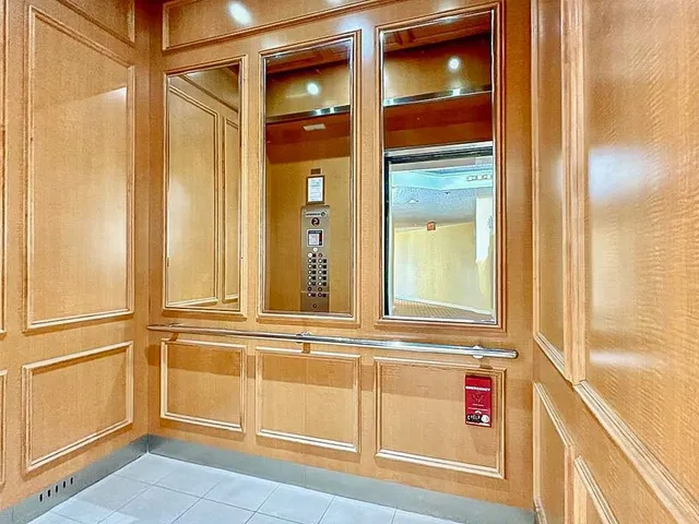 an aerial view of a house with a yard and lake view