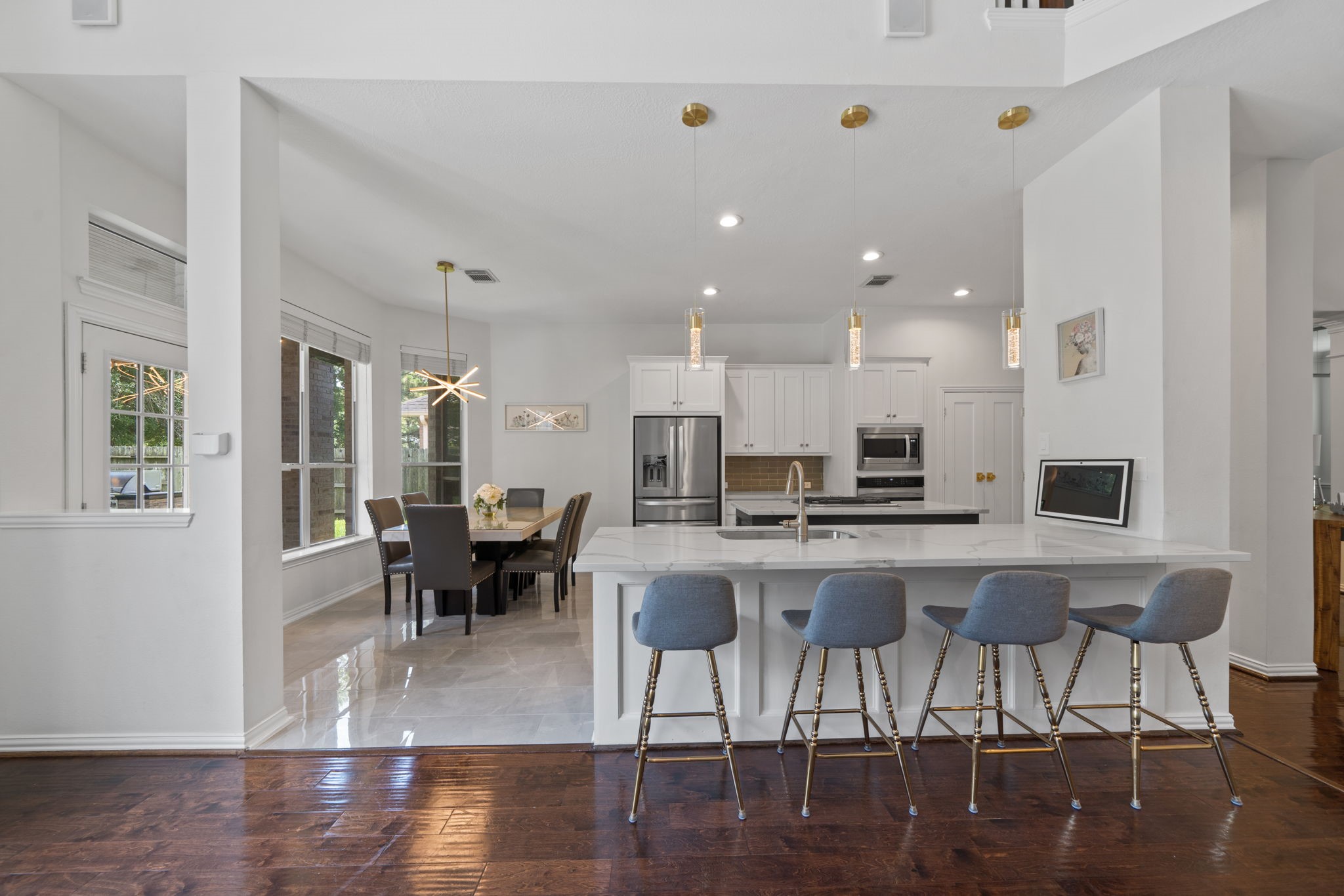 14718 Ramblebrook Humble, TX 77396 - Photo 10 of 38 A spacious kitchen with quartz countertops and stainless steel appliances.