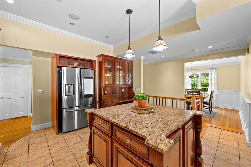 2 Herbert Road Worcester, MA 01602 - Photo 14 of 33 a view of a kitchen with granite countertop a refrigerator a oven and a dining table
