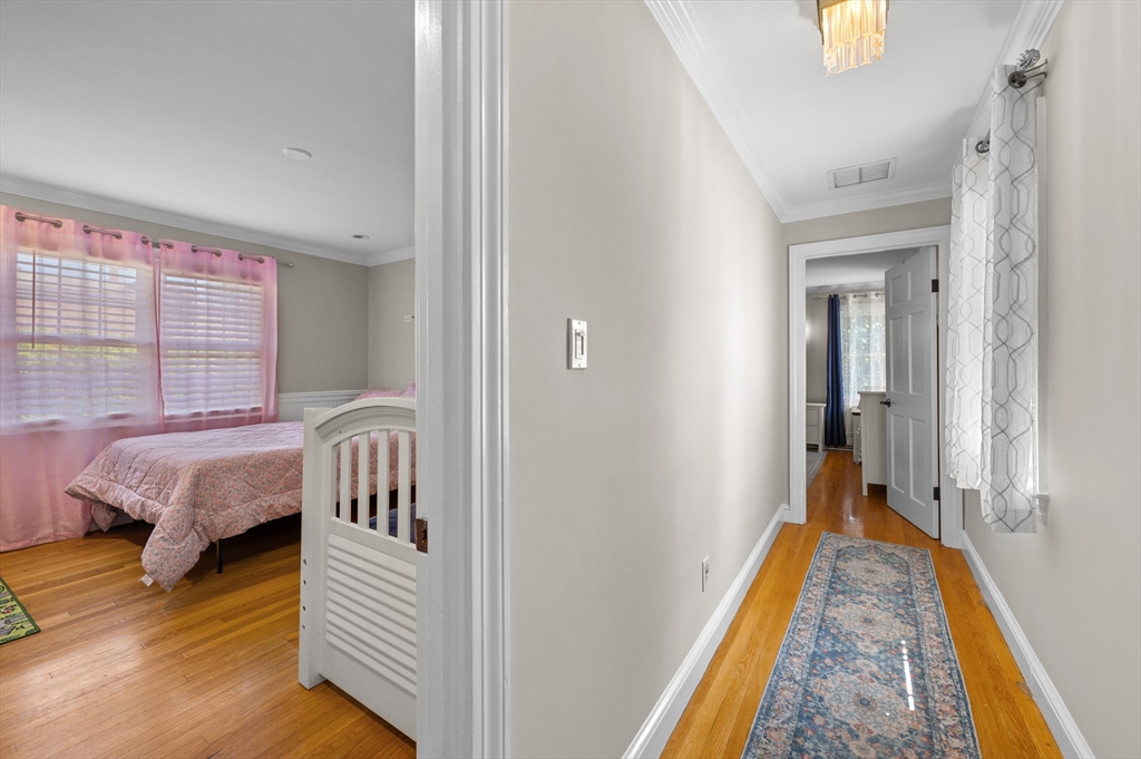 2 Herbert Road Worcester, MA 01602 - Photo 23 of 33 a view of a bedroom with wooden floor and balcony
