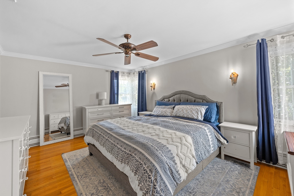 2 Herbert Road Worcester, MA 01602 - Photo 25 of 33 a bedroom with a large bed and a chandelier