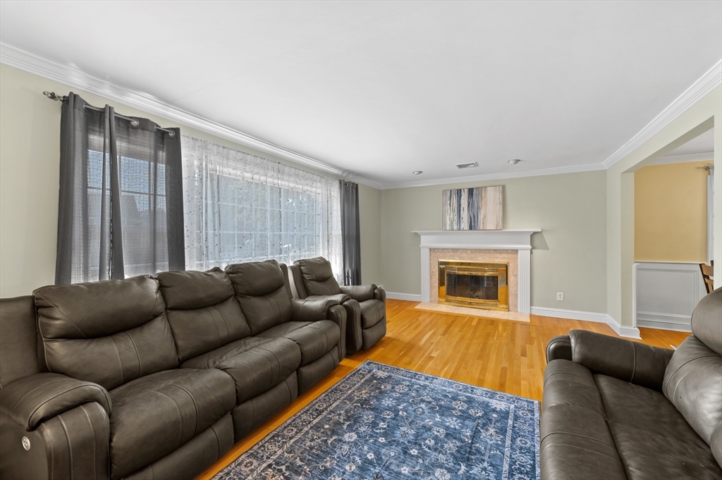 2 Herbert Road Worcester, MA 01602 - Photo 4 of 33 a living room with furniture a fireplace and a window