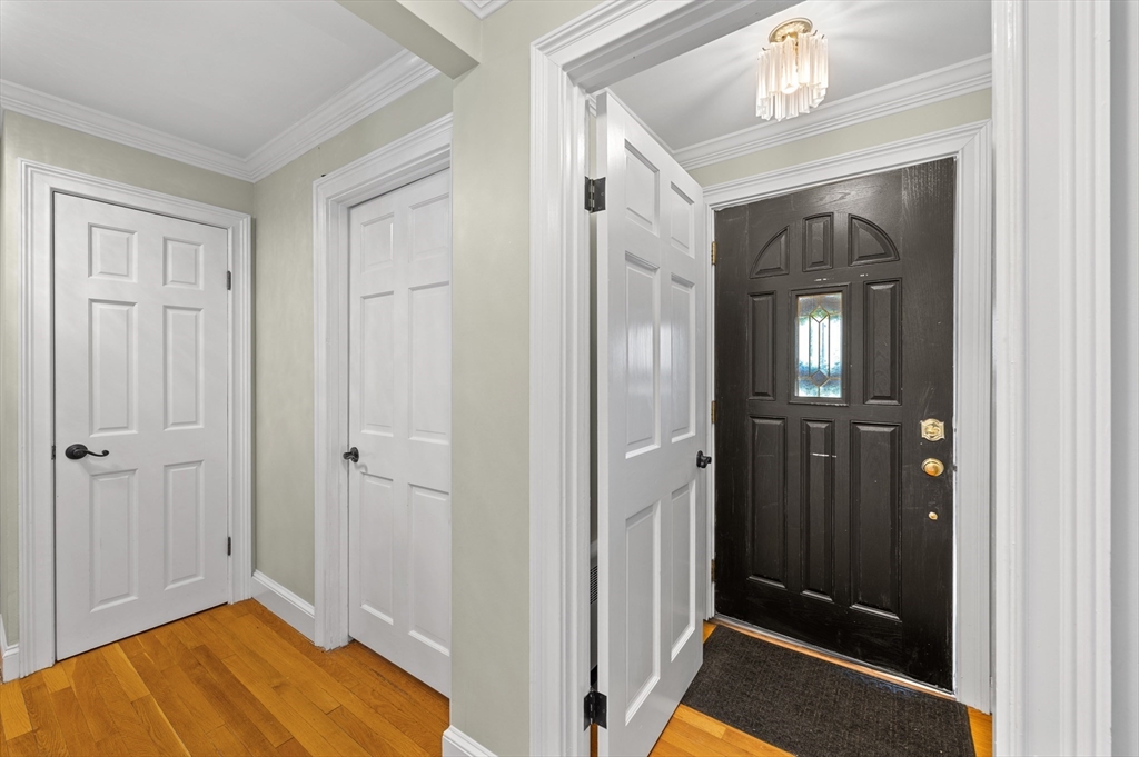 2 Herbert Road Worcester, MA 01602 - Photo 8 of 33 a view of a hallway with wooden floor and staircase