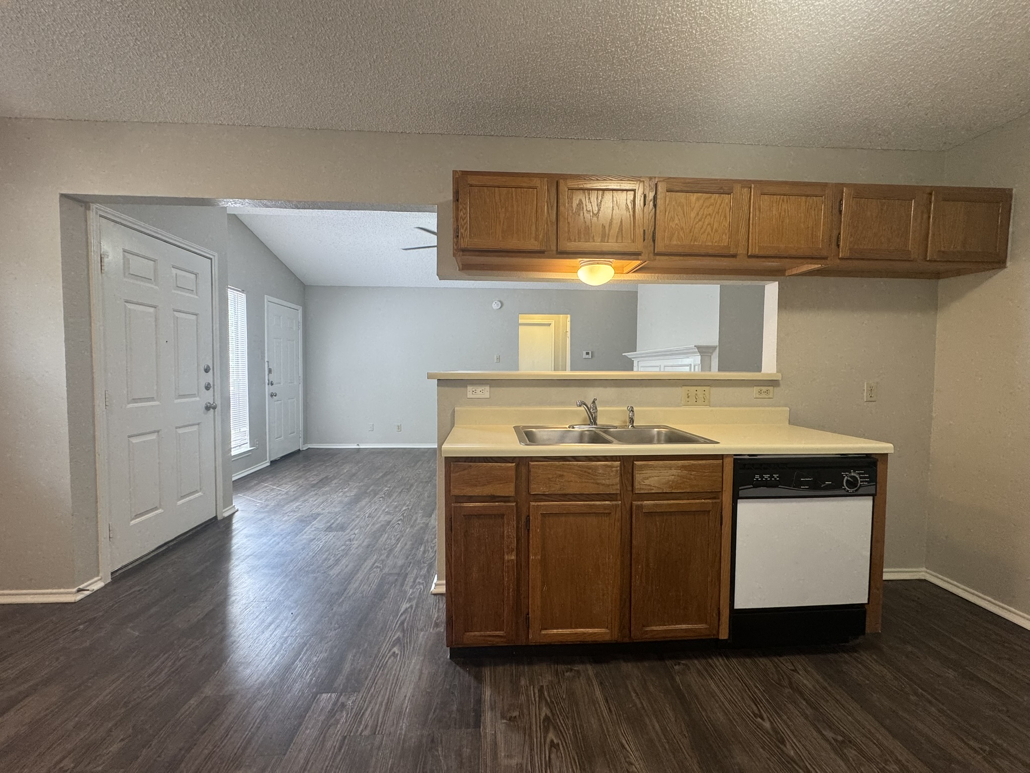 522 Cutty Trail, Unit B Lakeway, TX 78734 - Photo 9 of 20 A well-appointed kitchen featuring a practical breakfast bar for casual dining.