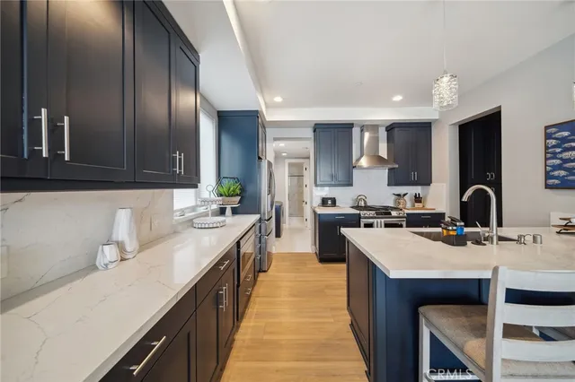 a bathroom with a double vanity sink a mirror and a shower