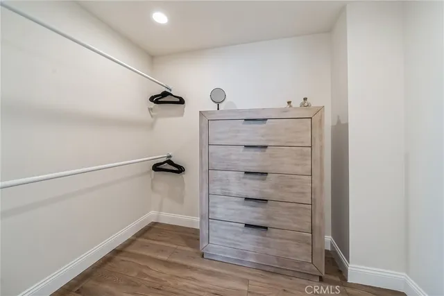a view of a roof deck with couches and sky view