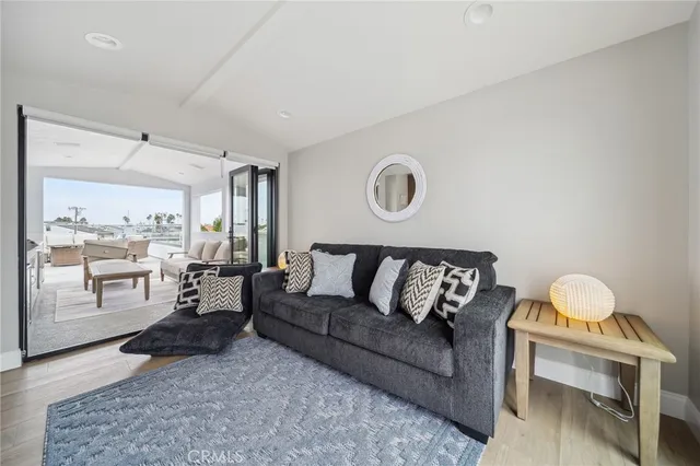 a view of a roof deck with couches and potted plants