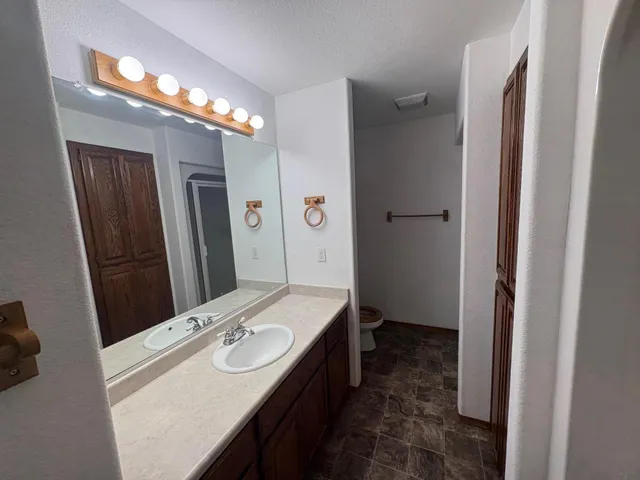 a bedroom with a bed and a shower