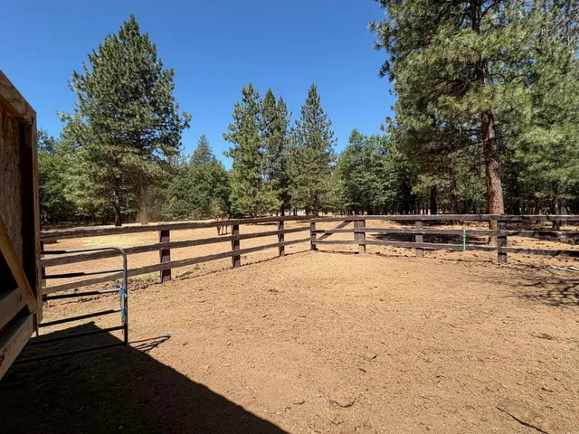 a view of a street with cars parked