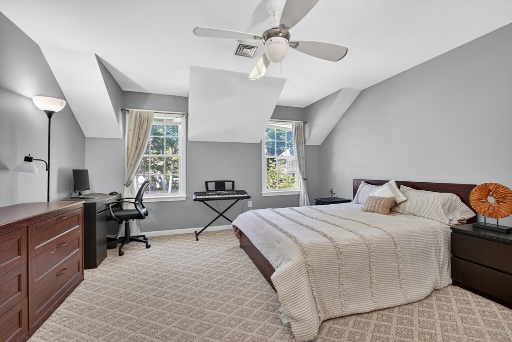 15 Evergreen Circle, Unit 15 Canton, MA 02021 - Photo 20 of 29 a bedroom with bed and a chandelier