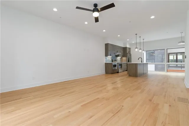 a view of kitchen and refrigerator