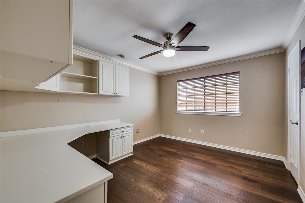 15720 Golden Creek Road Dallas, TX 75248 - Photo 13 of 25 This room features dark hardwood flooring, a ceiling fan with integrated lighting, and a window with blinds