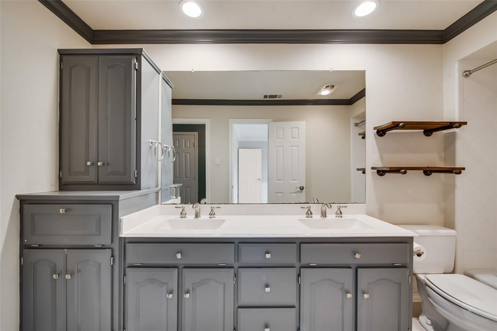 15720 Golden Creek Road Dallas, TX 75248 - Photo 20 of 25 Bathroom featuring a dual vanity with grey cabinetry and white countertops, a large mirror, and recessed lighting