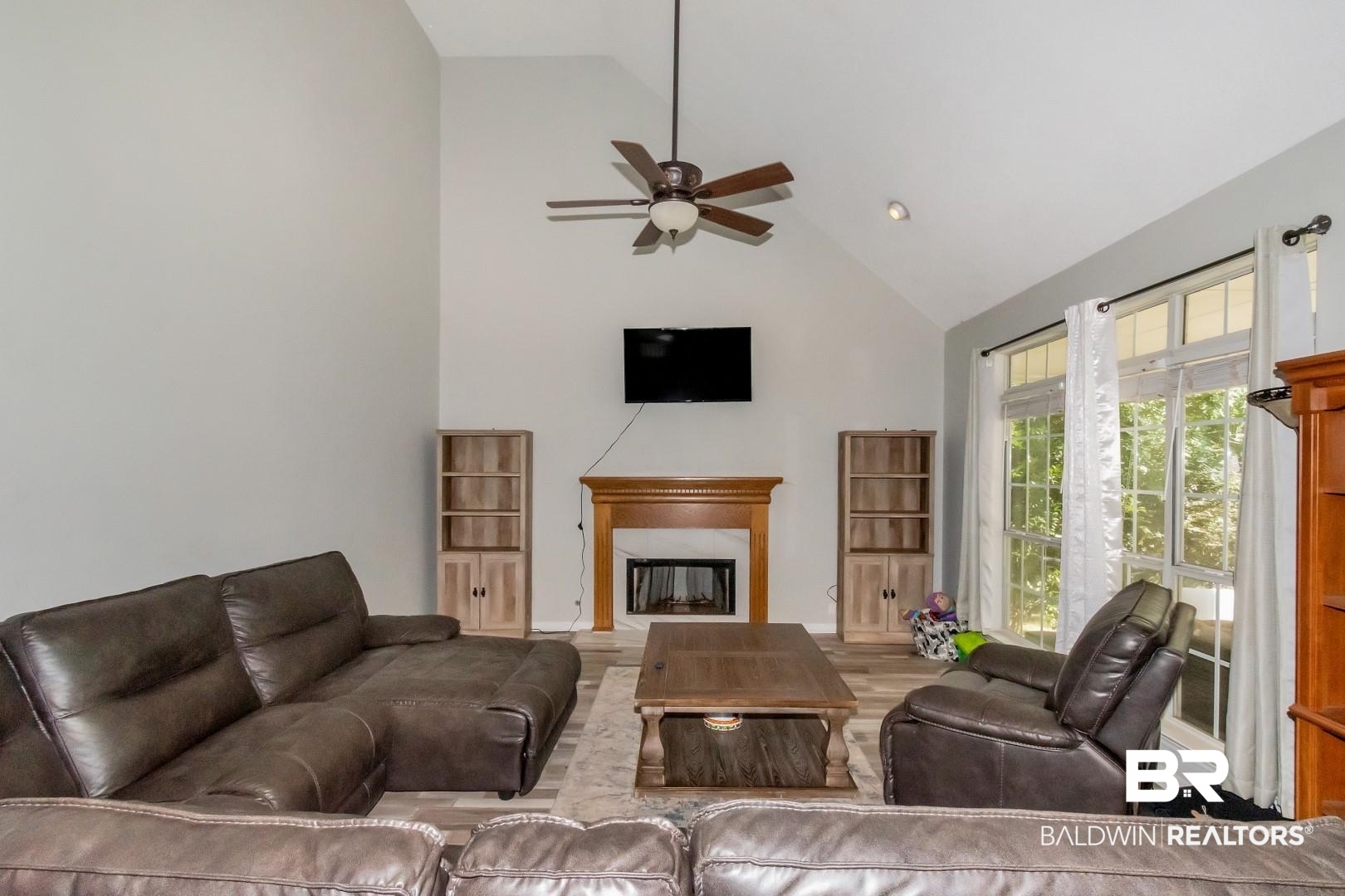 9991 Wedgefield Court Mobile, AL 36608 - Photo 4 of 30 Living room featuring wood-type flooring, ceiling fan, and high vaulted ceiling