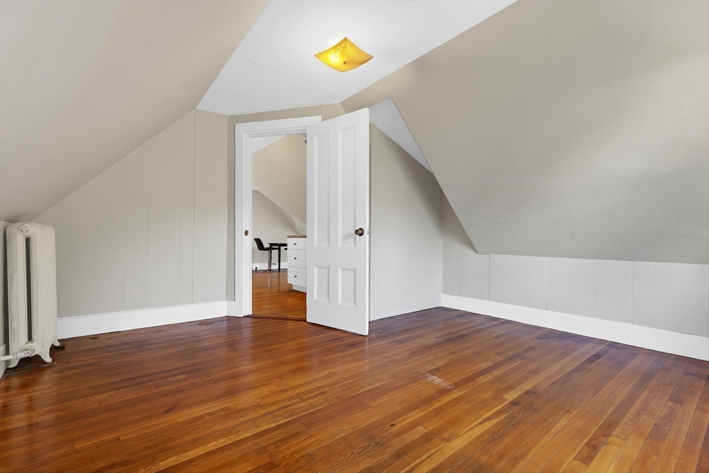28 Evergreen Street, Unit 3 Boston, MA 02130 - Photo 14 of 16 wooden floor in an empty room