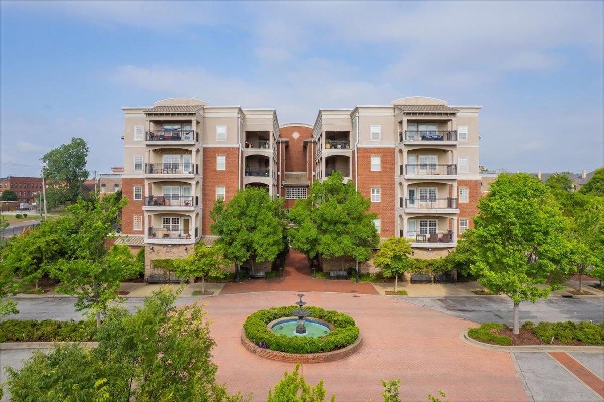 665 Tennessee Street, Unit 306 Memphis, TN 38103 - Photo 1 of 35 a view of a swimming pool in front of house