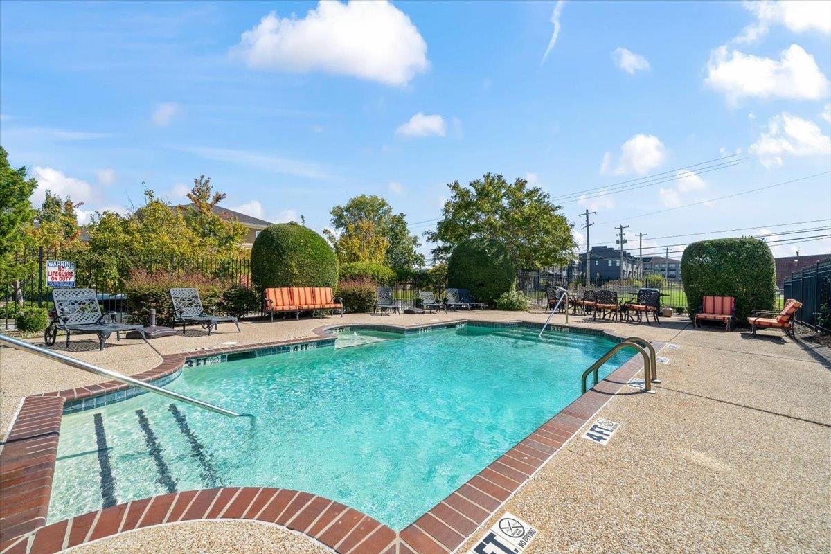665 Tennessee Street, Unit 306 Memphis, TN 38103 - Photo 33 of 35 a swimming pool with outdoor seating and yard