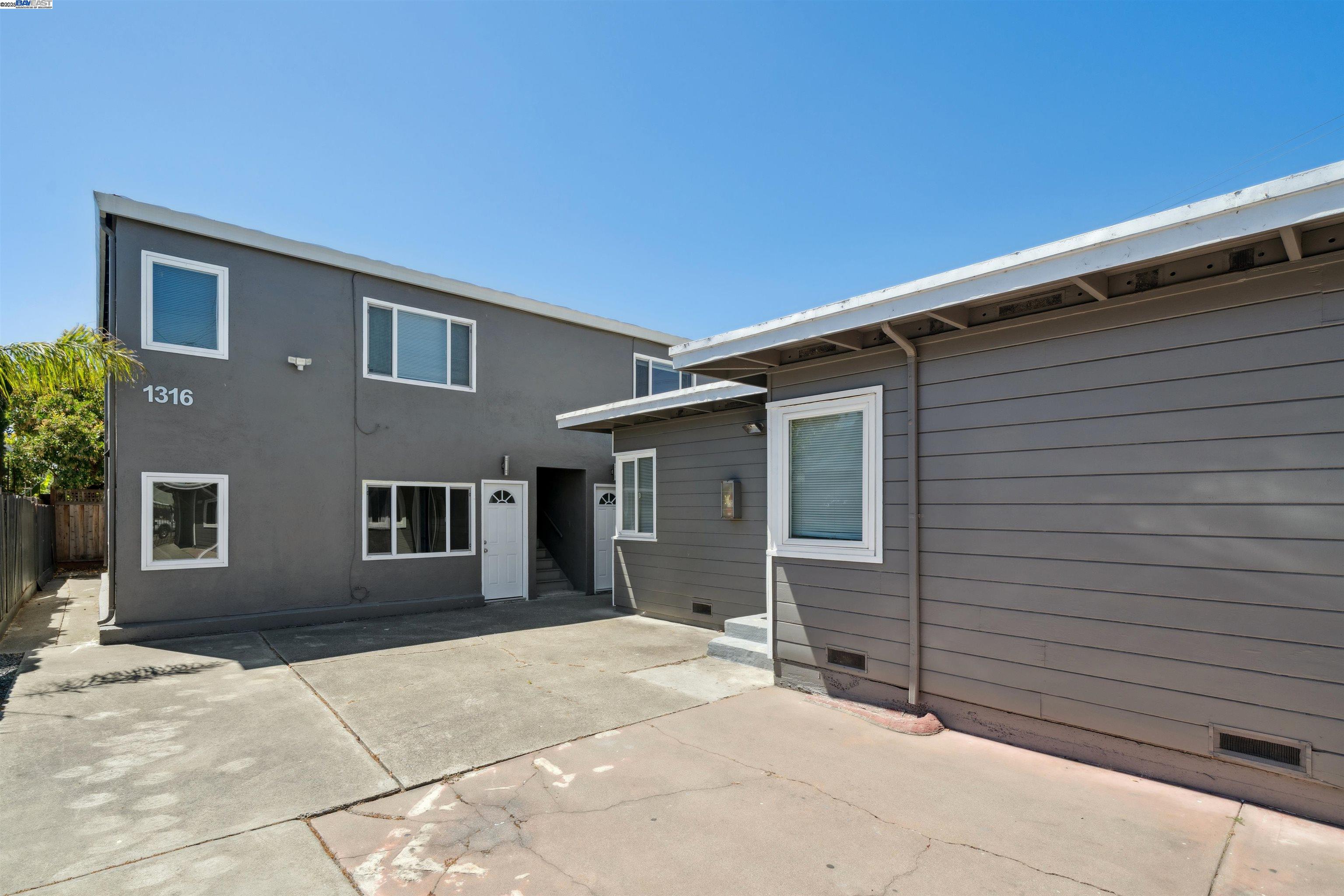 1314 Ashby Avenue Berkeley, CA 94702 - Photo 2 of 8 a backyard of a house with yard and garage