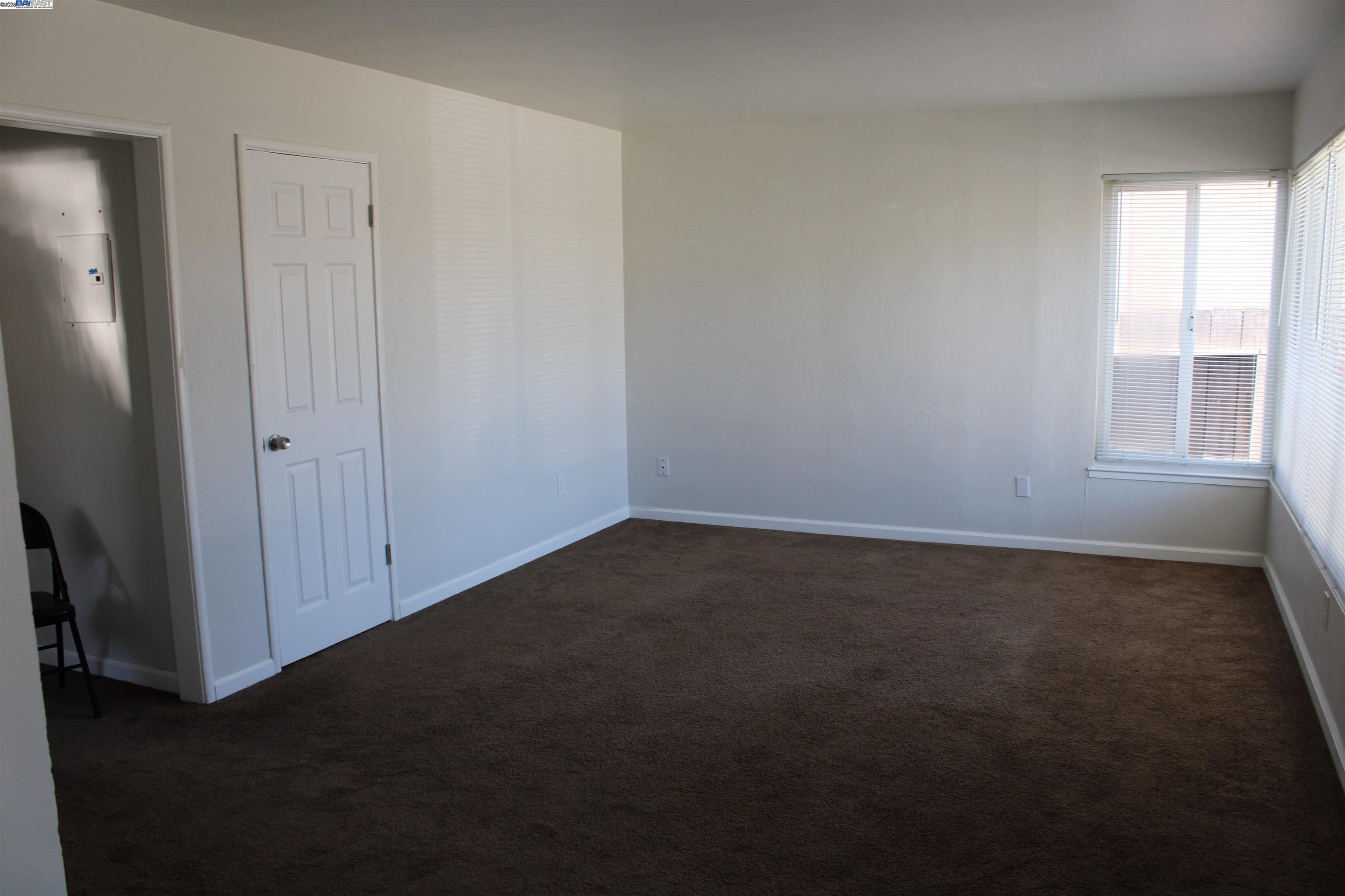 1314 Ashby Avenue Berkeley, CA 94702 - Photo 5 of 8 an empty room with windows