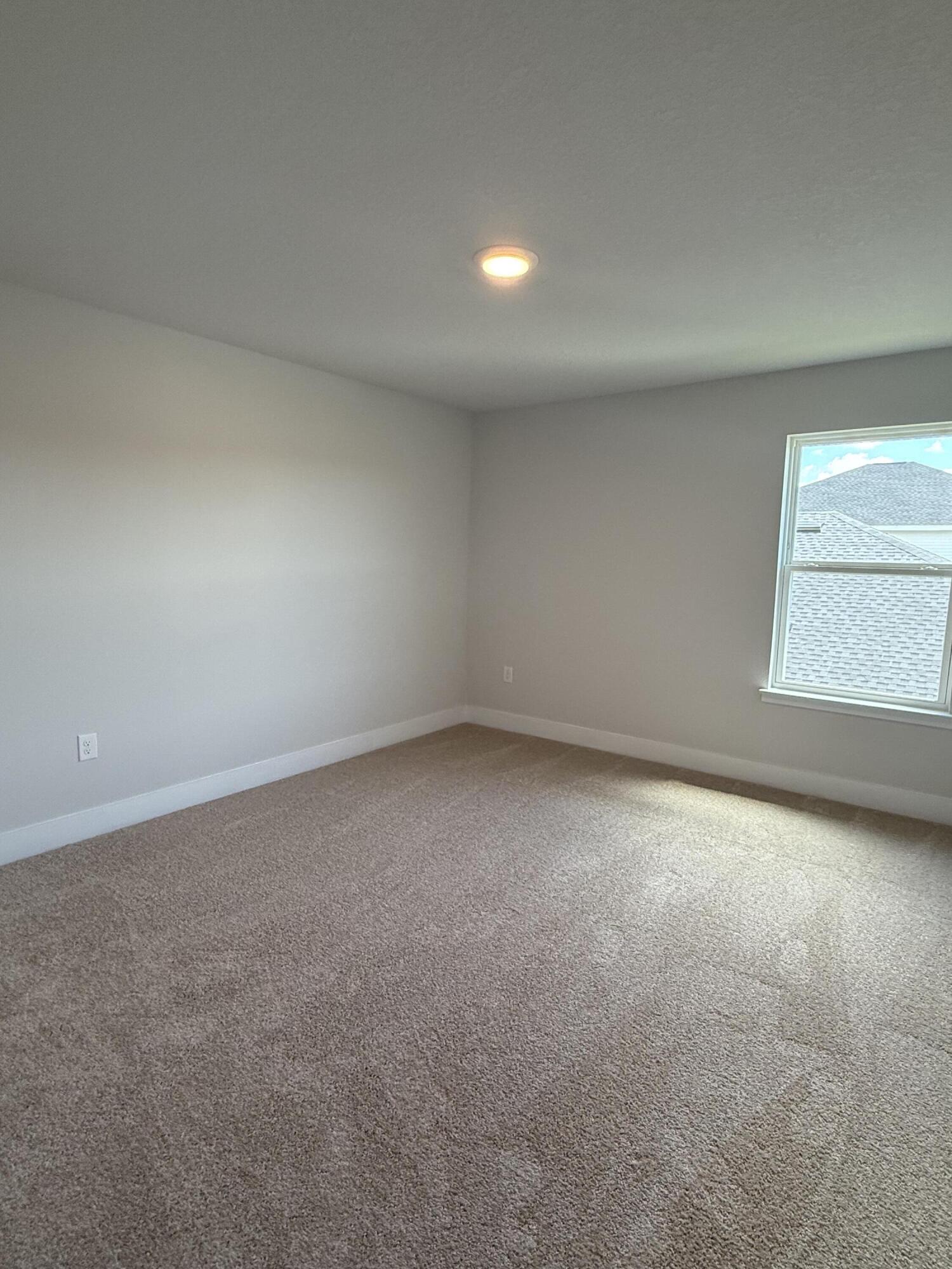 2410 Aleia Lane Crestview, FL 32536 - Photo 12 of 37 an empty room with a window