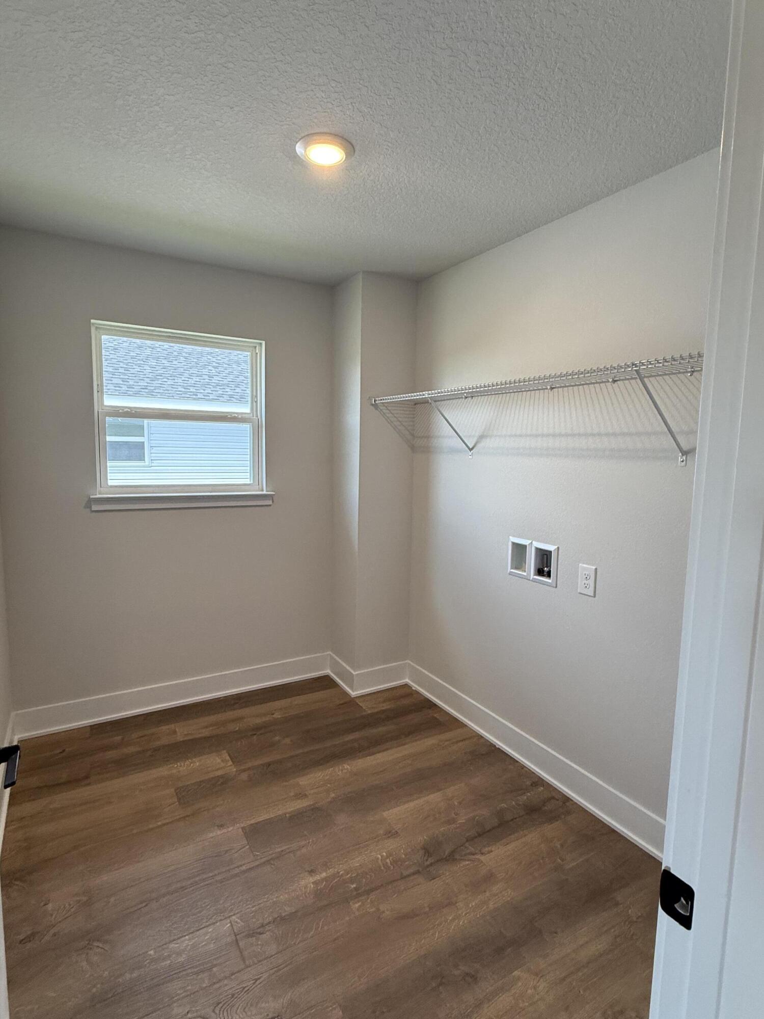 2410 Aleia Lane Crestview, FL 32536 - Photo 14 of 37 an empty room with a workbench
