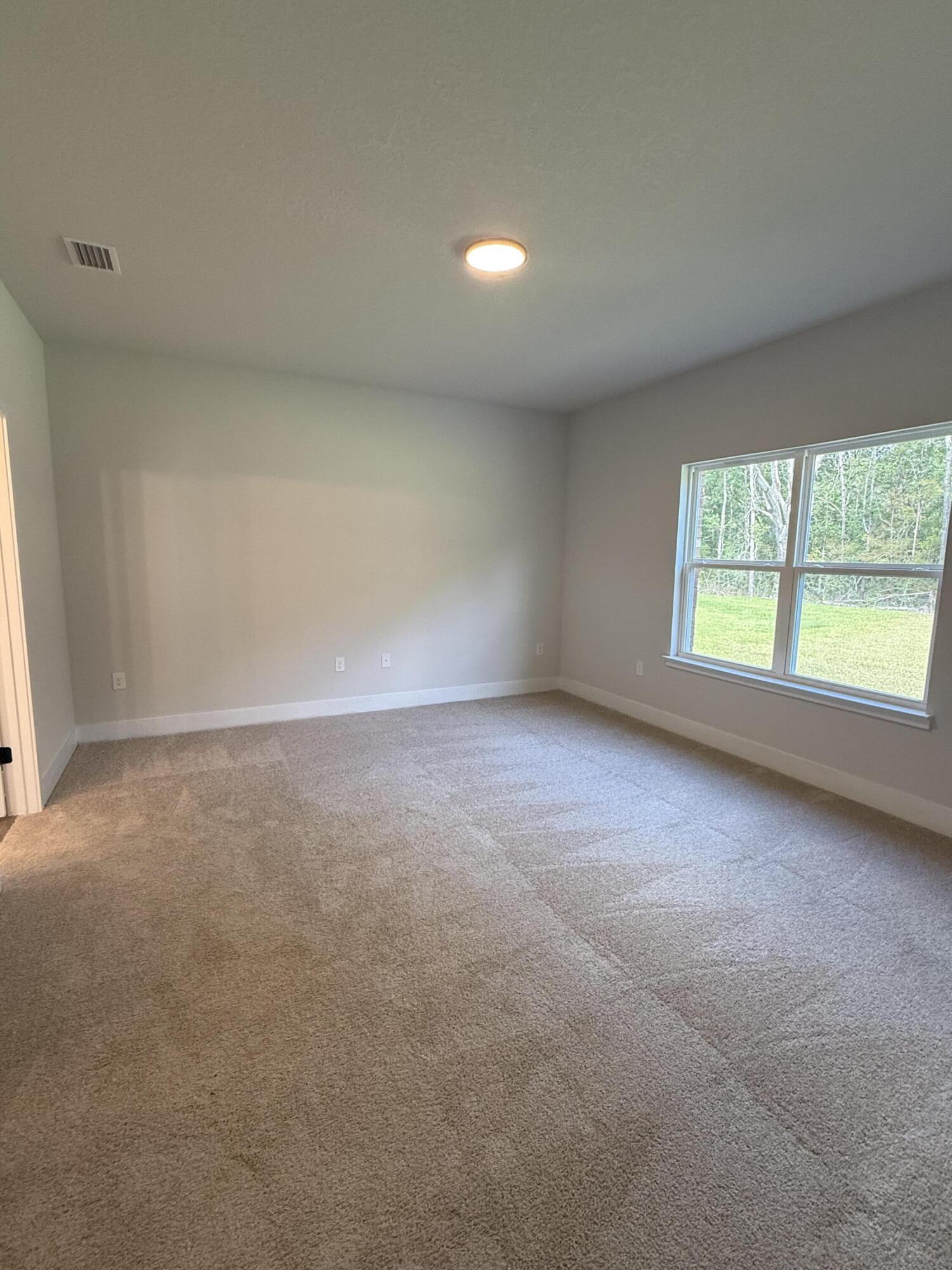 2410 Aleia Lane Crestview, FL 32536 - Photo 24 of 37 an empty room with windows