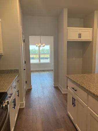 an entryway with wooden floor