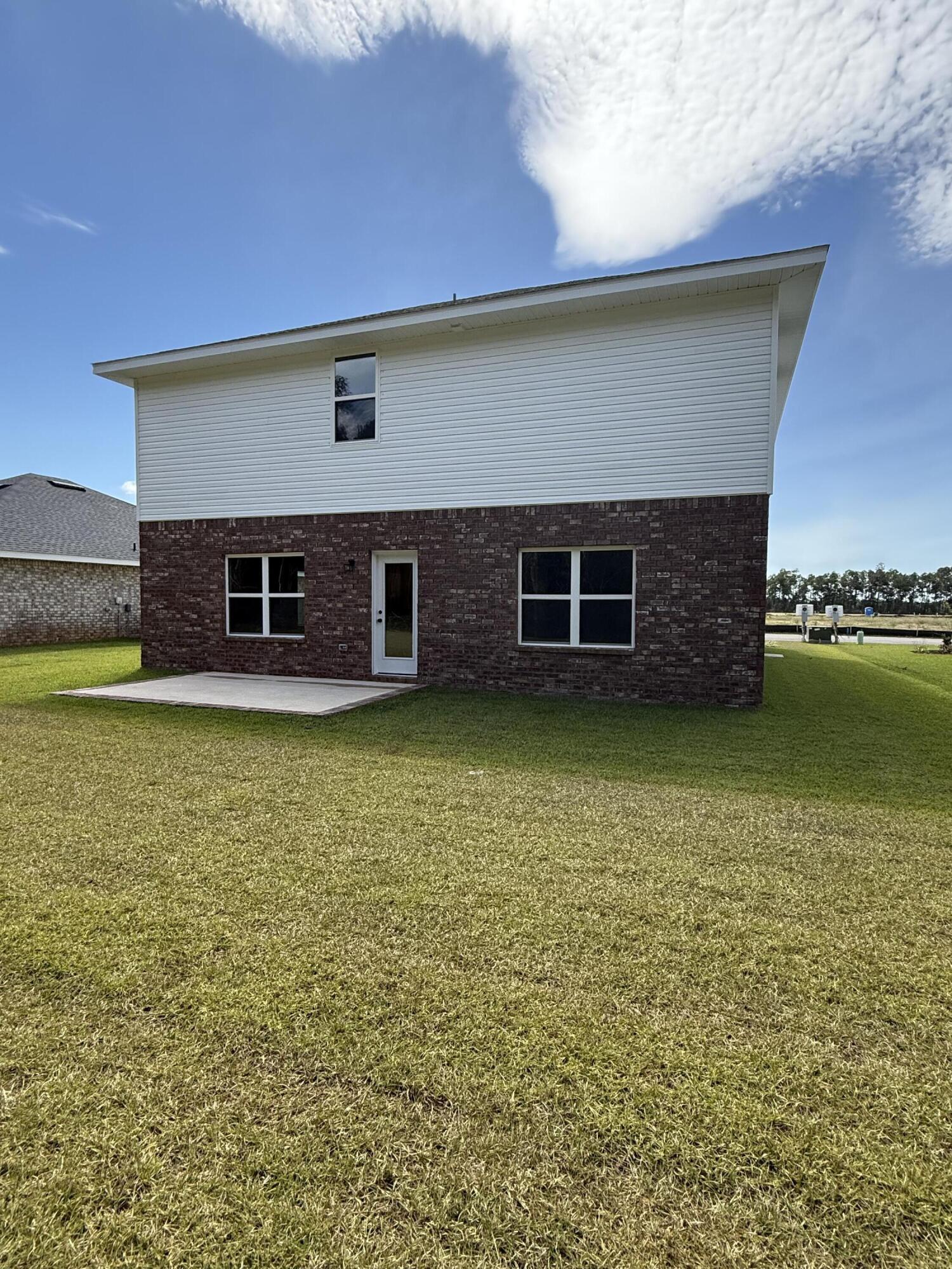 2410 Aleia Lane Crestview, FL 32536 - Photo 5 of 37 a view of a house with a lake view