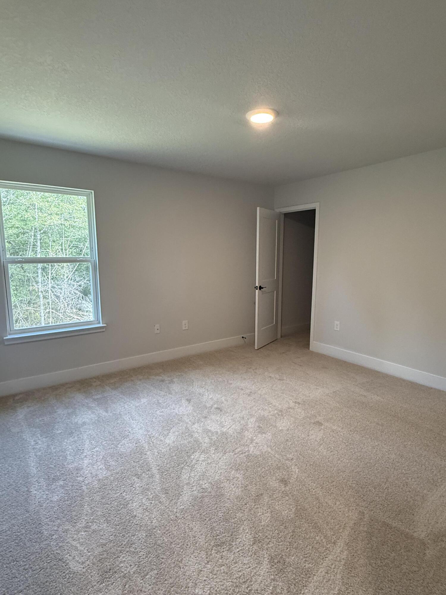 2410 Aleia Lane Crestview, FL 32536 - Photo 7 of 37 an empty room with a window