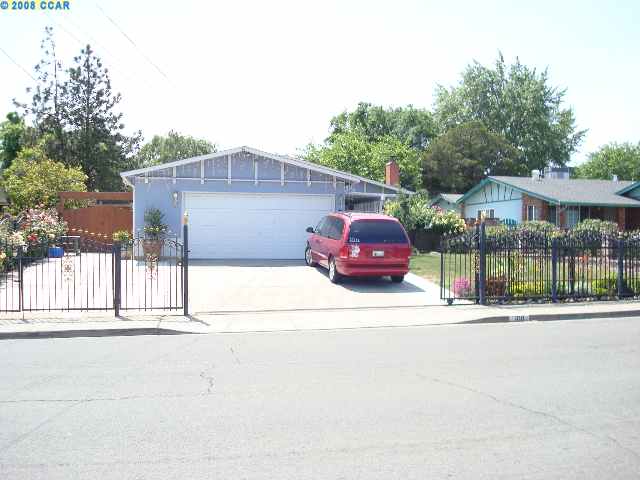 391 Shore Road Bay Point, CA 94565 - Photo 1 of 1 a couple of cars parked in front of a house