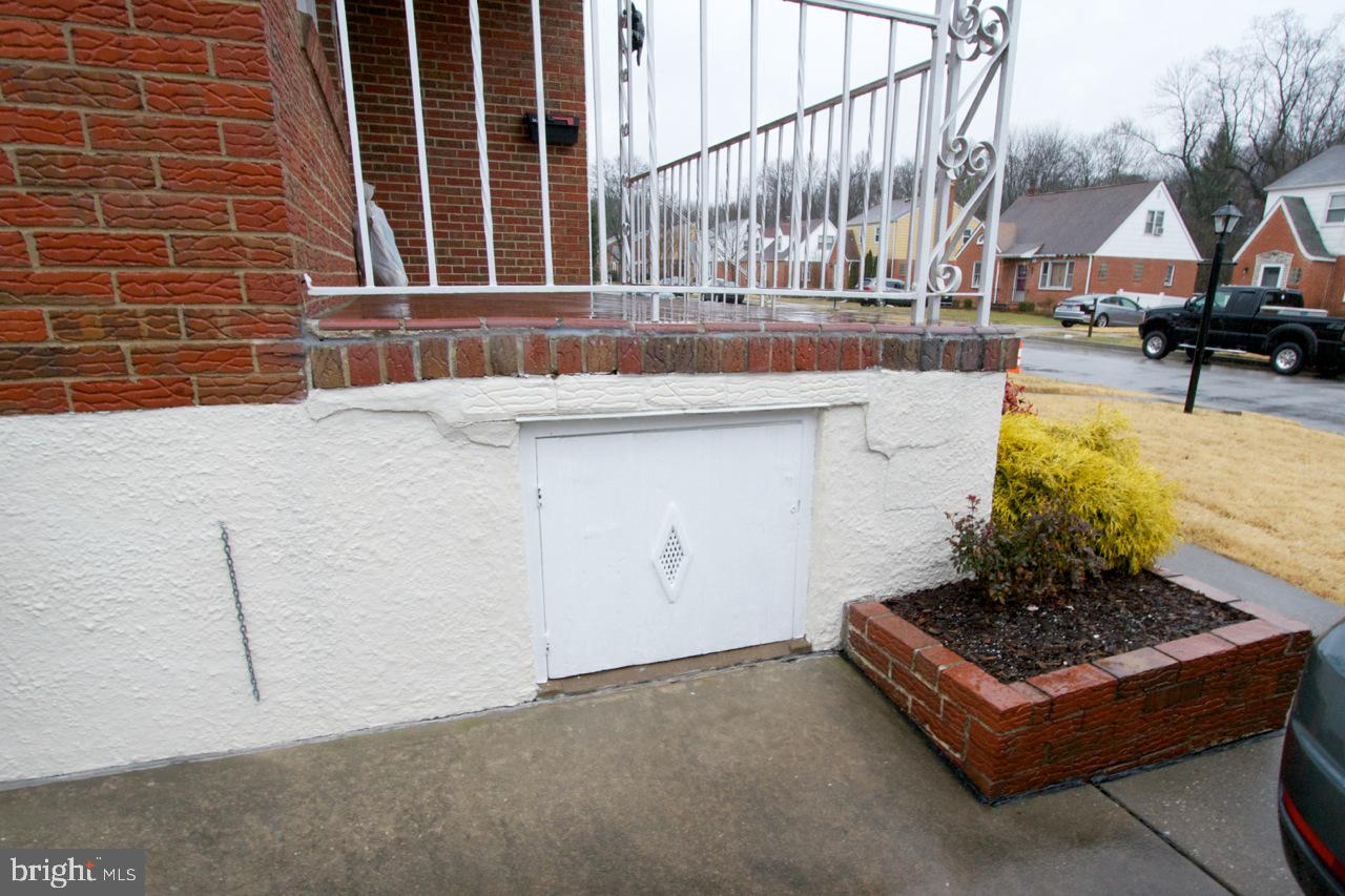 8110 Woodhaven Road Baltimore, MD 21237 - Photo 18 of 25 Entrance To Storage Under Front Porch