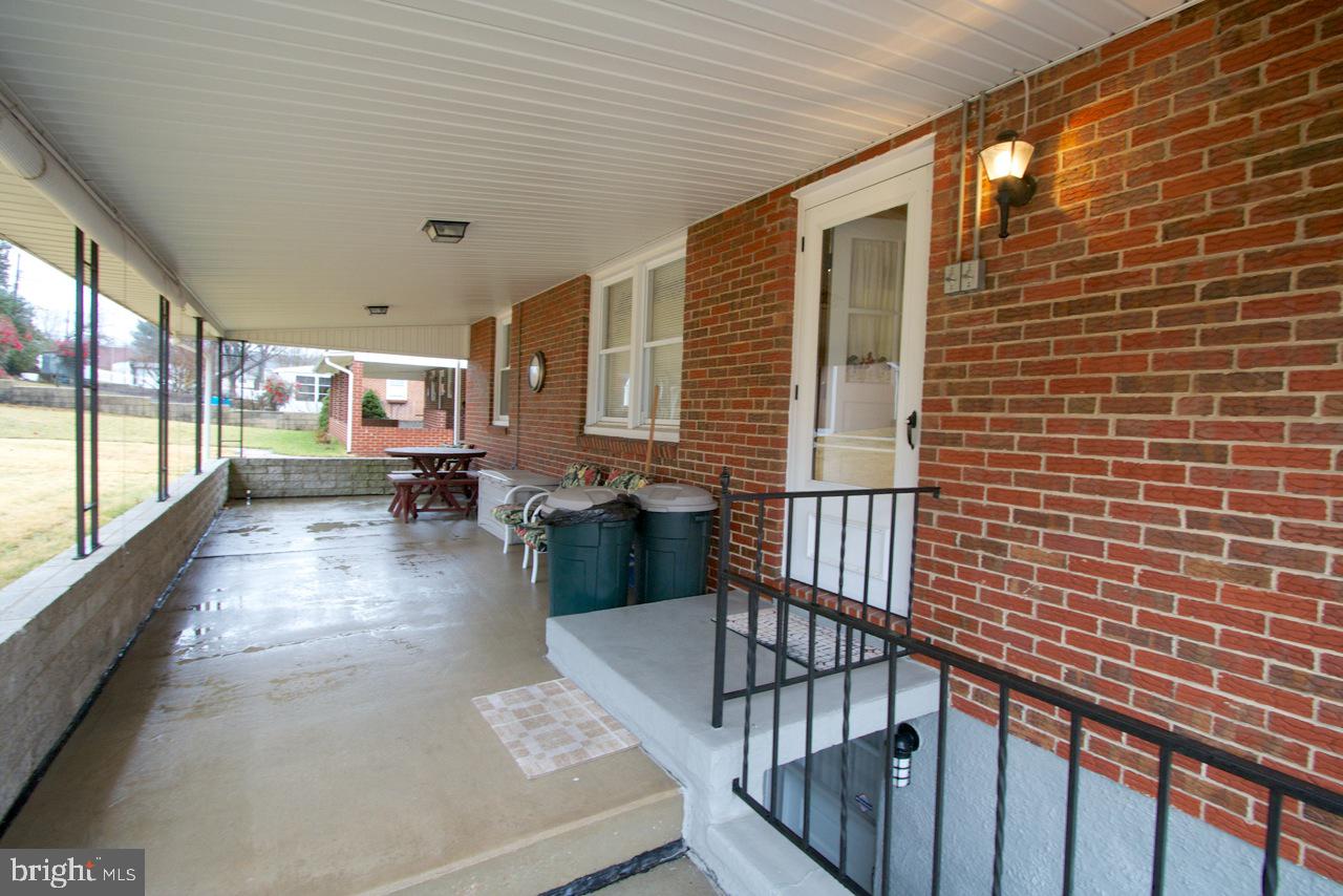 8110 Woodhaven Road Baltimore, MD 21237 - Photo 20 of 25 Side View of Back Patio With Pull Down Sun Screens