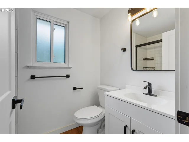 a view of a room with wooden stairs