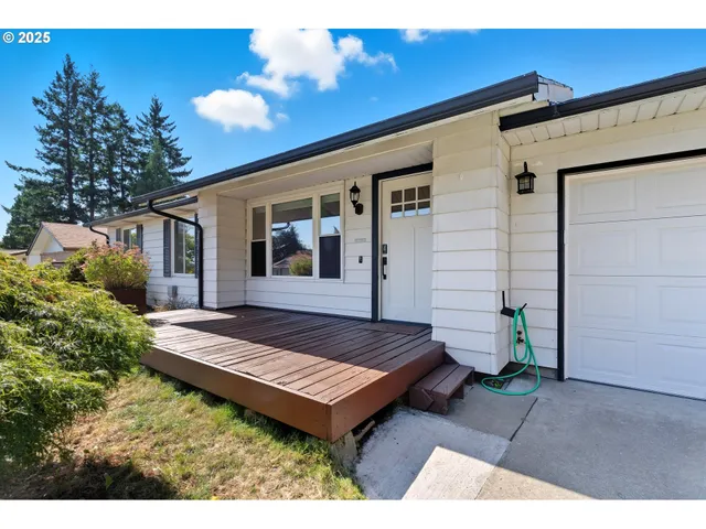 a view of a two chairs in patio of the house