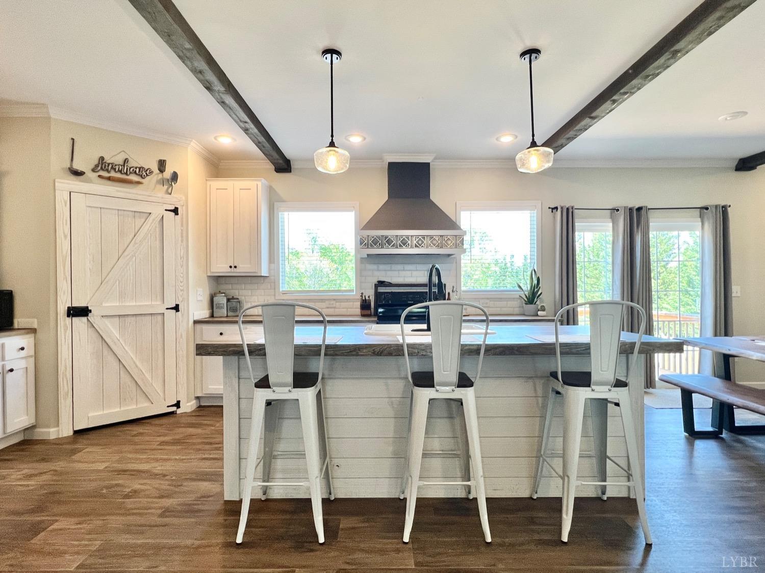 2747 Five Forks Road Bedford, VA 24523 - Photo 11 of 40 a kitchen with stainless steel appliances granite countertop wooden floor window and cabinets