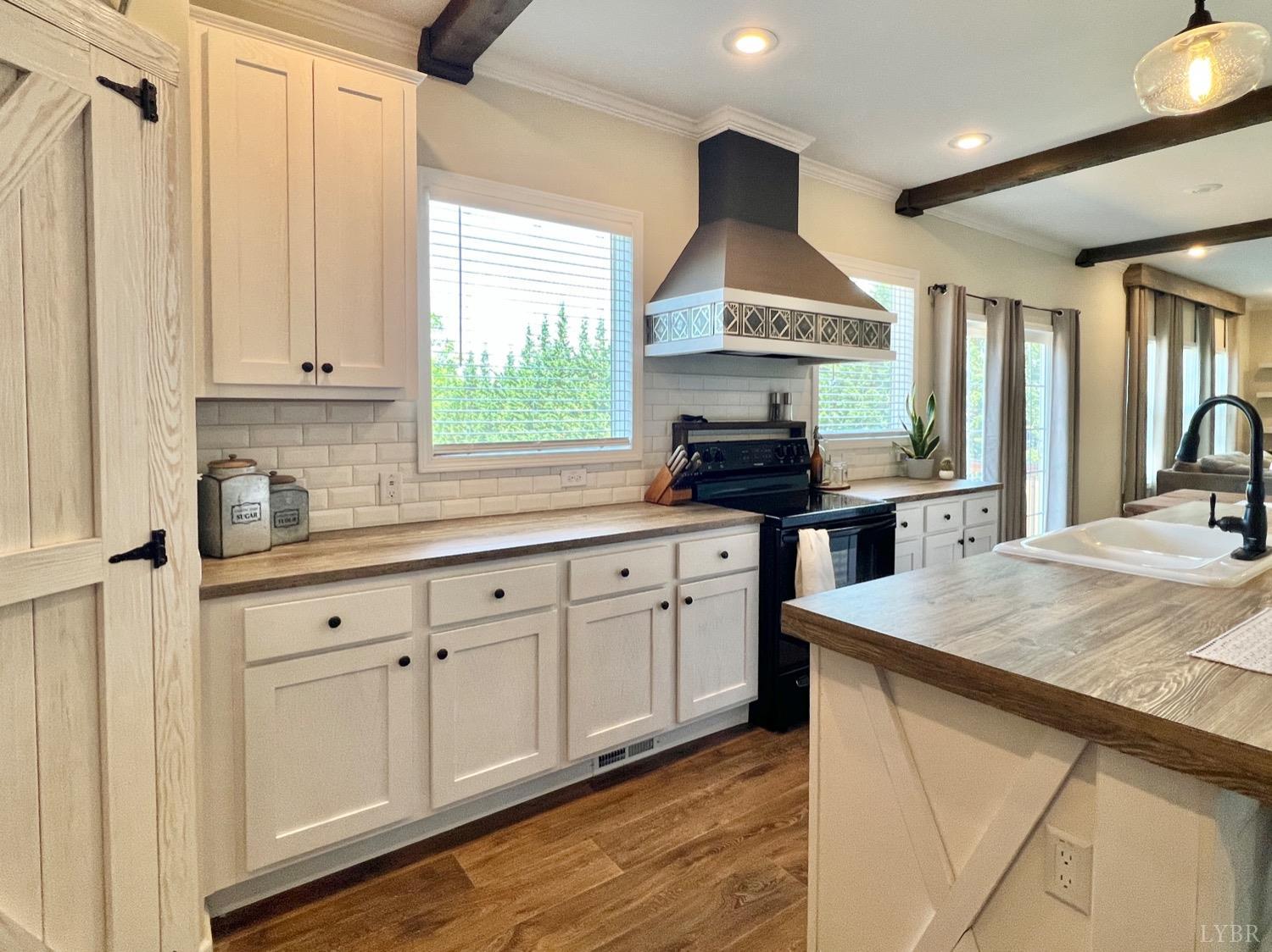 2747 Five Forks Road Bedford, VA 24523 - Photo 13 of 40 a kitchen with stainless steel appliances granite countertop a sink window and cabinets