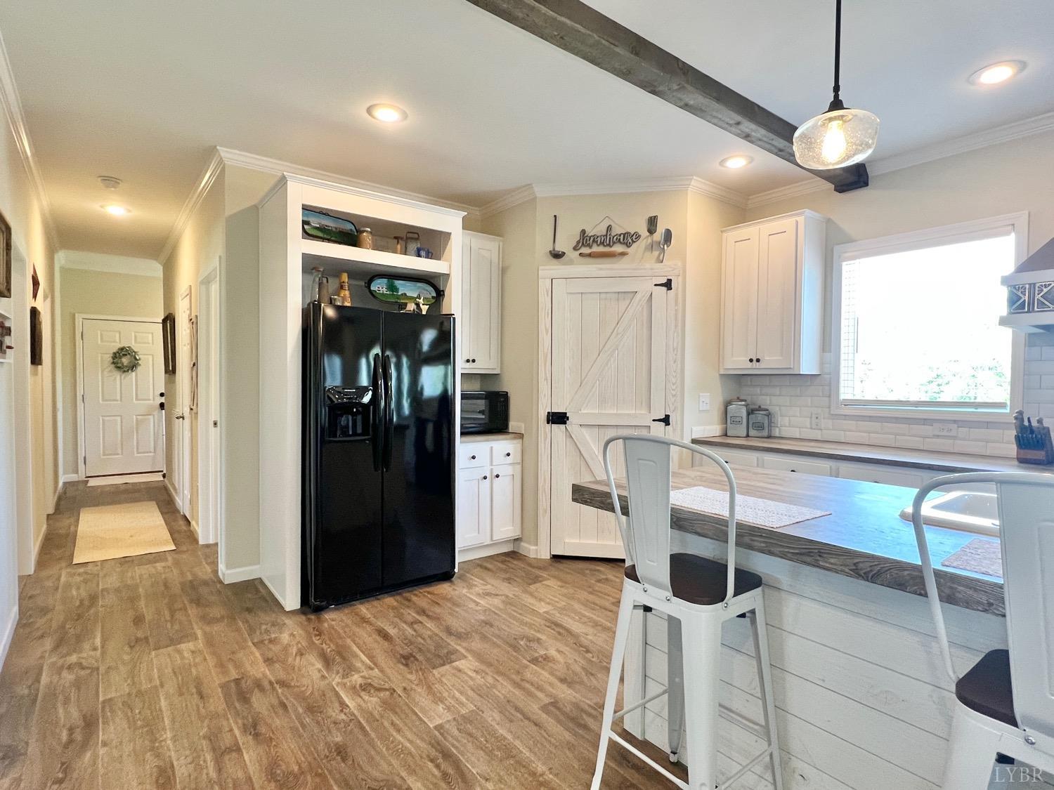 2747 Five Forks Road Bedford, VA 24523 - Photo 16 of 40 a kitchen with stainless steel appliances kitchen island granite countertop a refrigerator and a sink