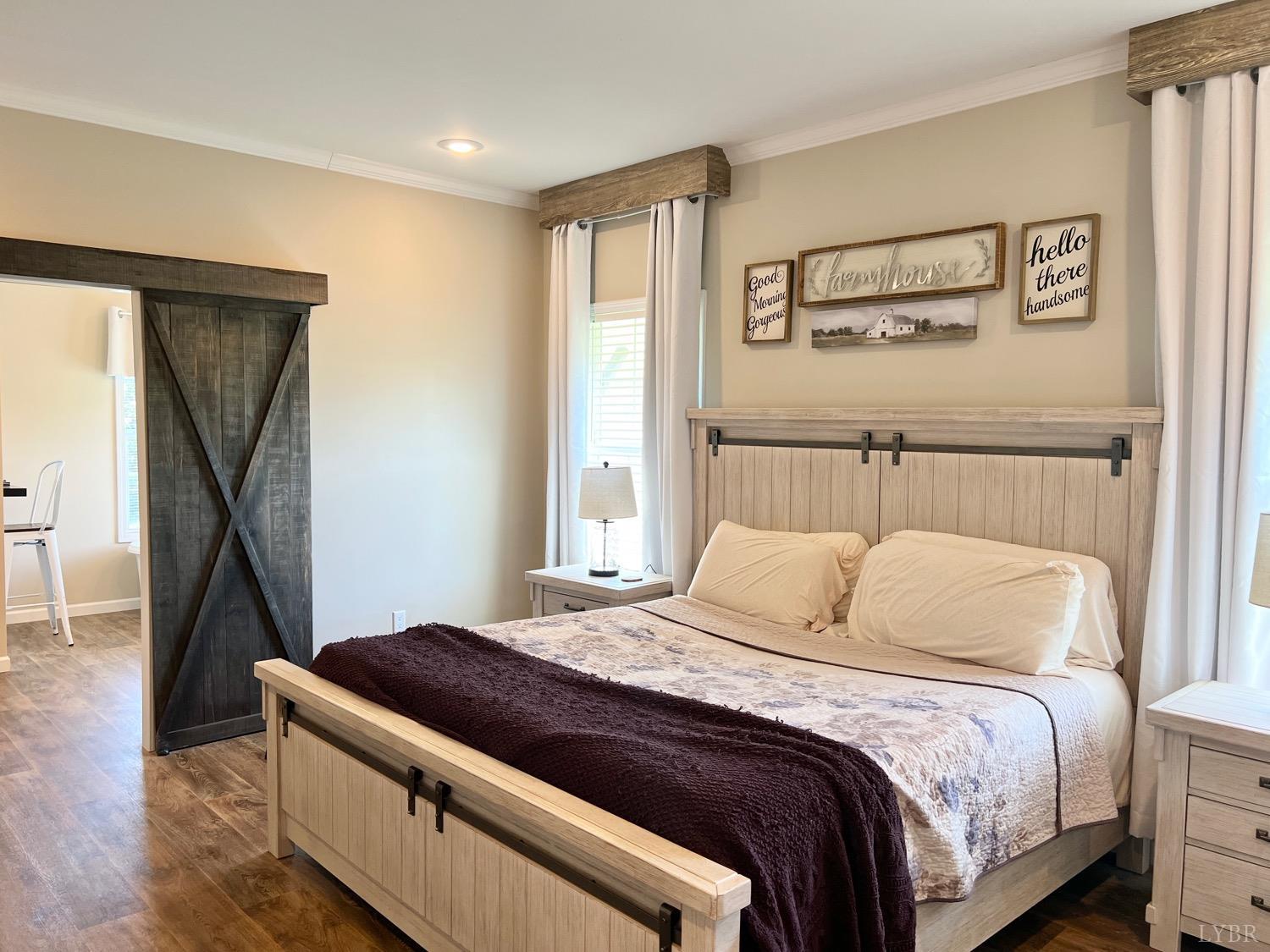 2747 Five Forks Road Bedford, VA 24523 - Photo 19 of 40 a bedroom with a bed and a large mirror