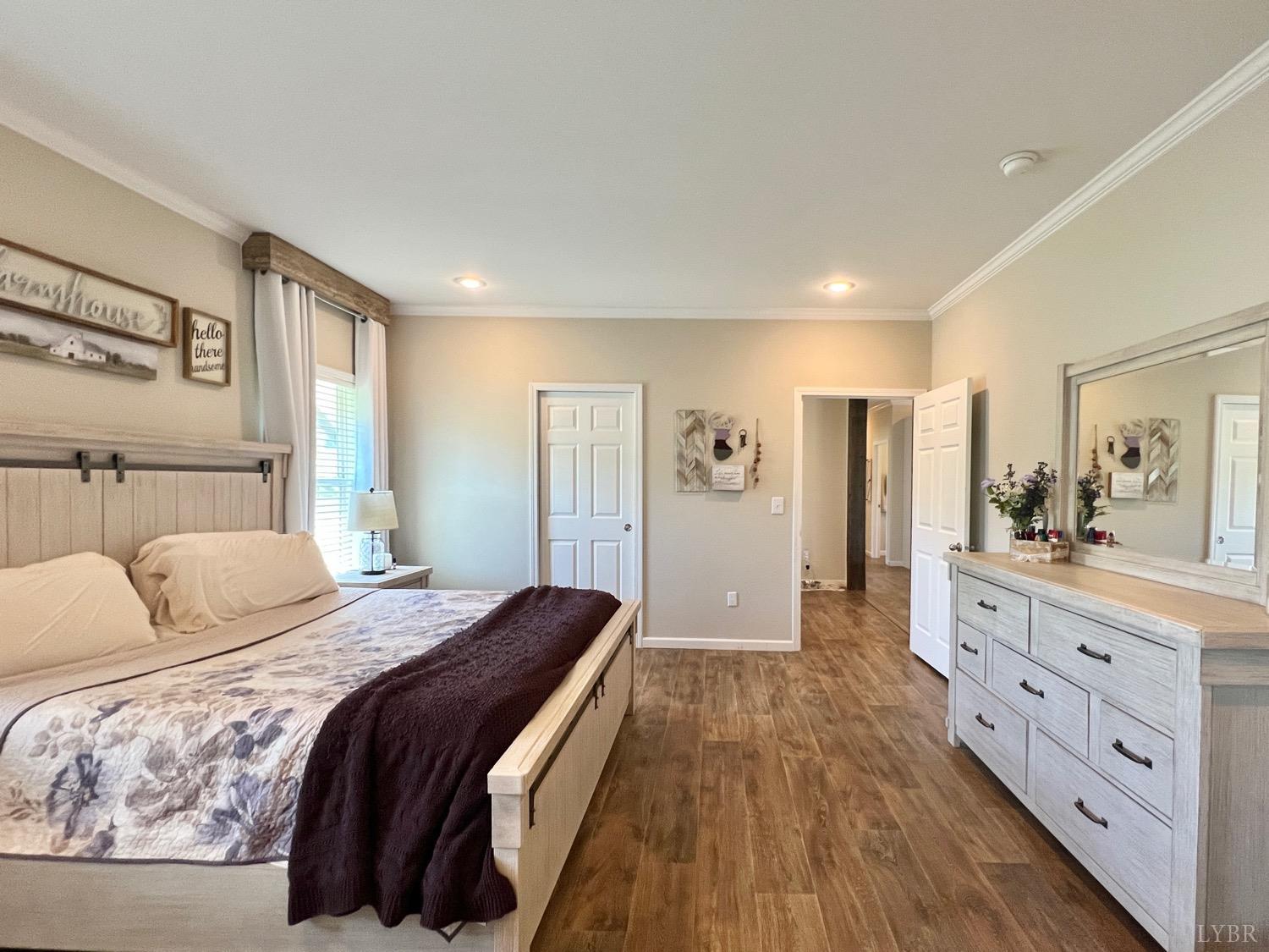 2747 Five Forks Road Bedford, VA 24523 - Photo 22 of 40 a spacious bedroom with a large bed and a dresser