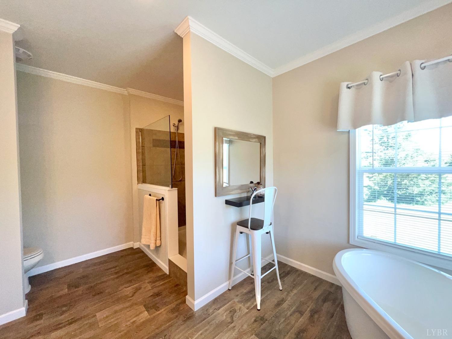 2747 Five Forks Road Bedford, VA 24523 - Photo 25 of 40 a view of a livingroom with wooden floor and a bathroom