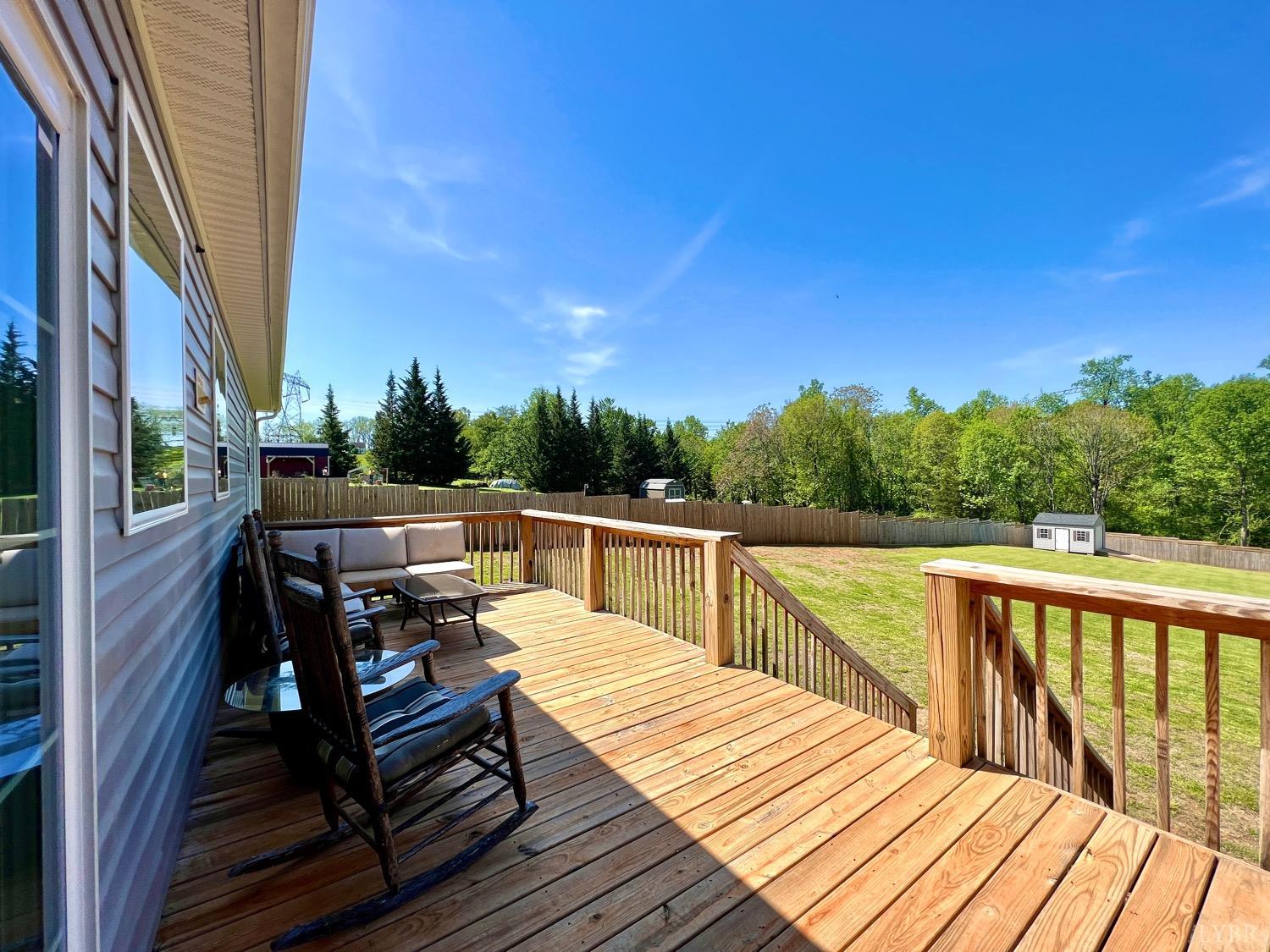 2747 Five Forks Road Bedford, VA 24523 - Photo 35 of 40 a view of deck with furniture and trees in the background
