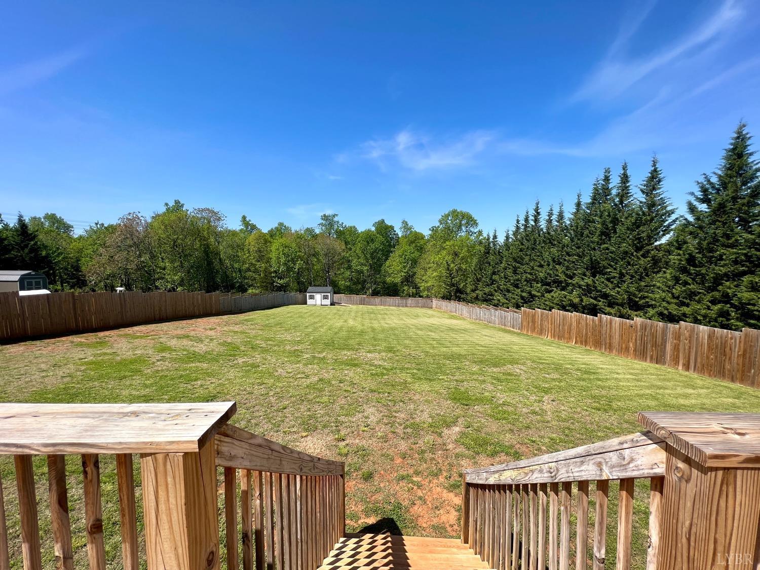 2747 Five Forks Road Bedford, VA 24523 - Photo 36 of 40 a view of a wooden deck with a yard
