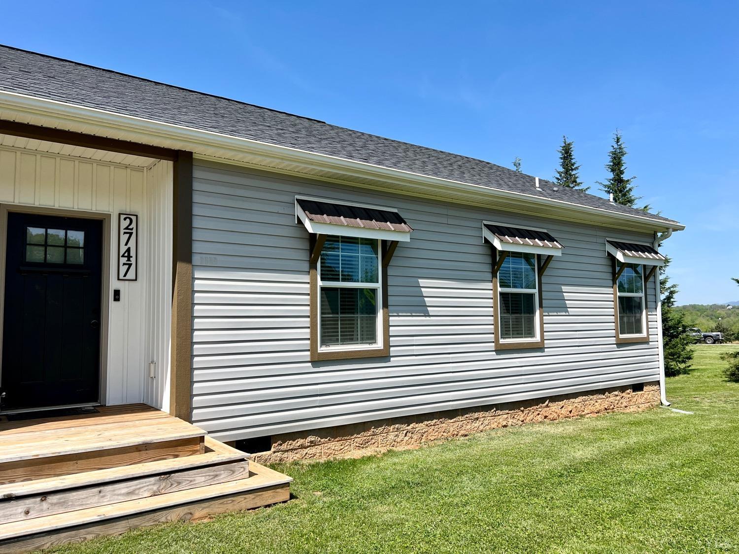 2747 Five Forks Road Bedford, VA 24523 - Photo 4 of 40 a front view of a house with a yard